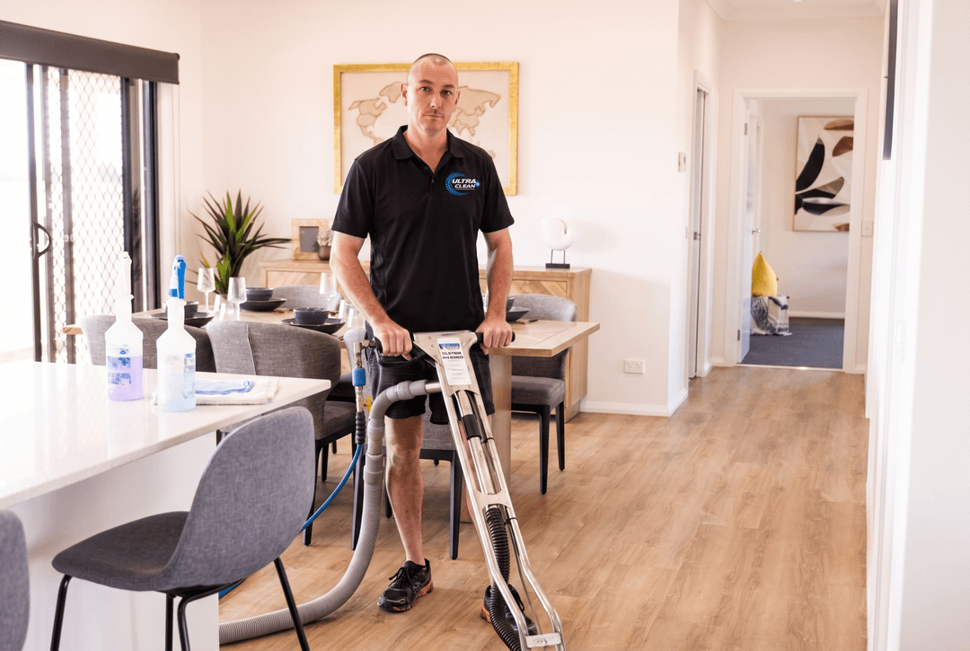 Commercial cleaning Swan Hill - Ultraclean owner Lee cleaning the hard floors of a new build
